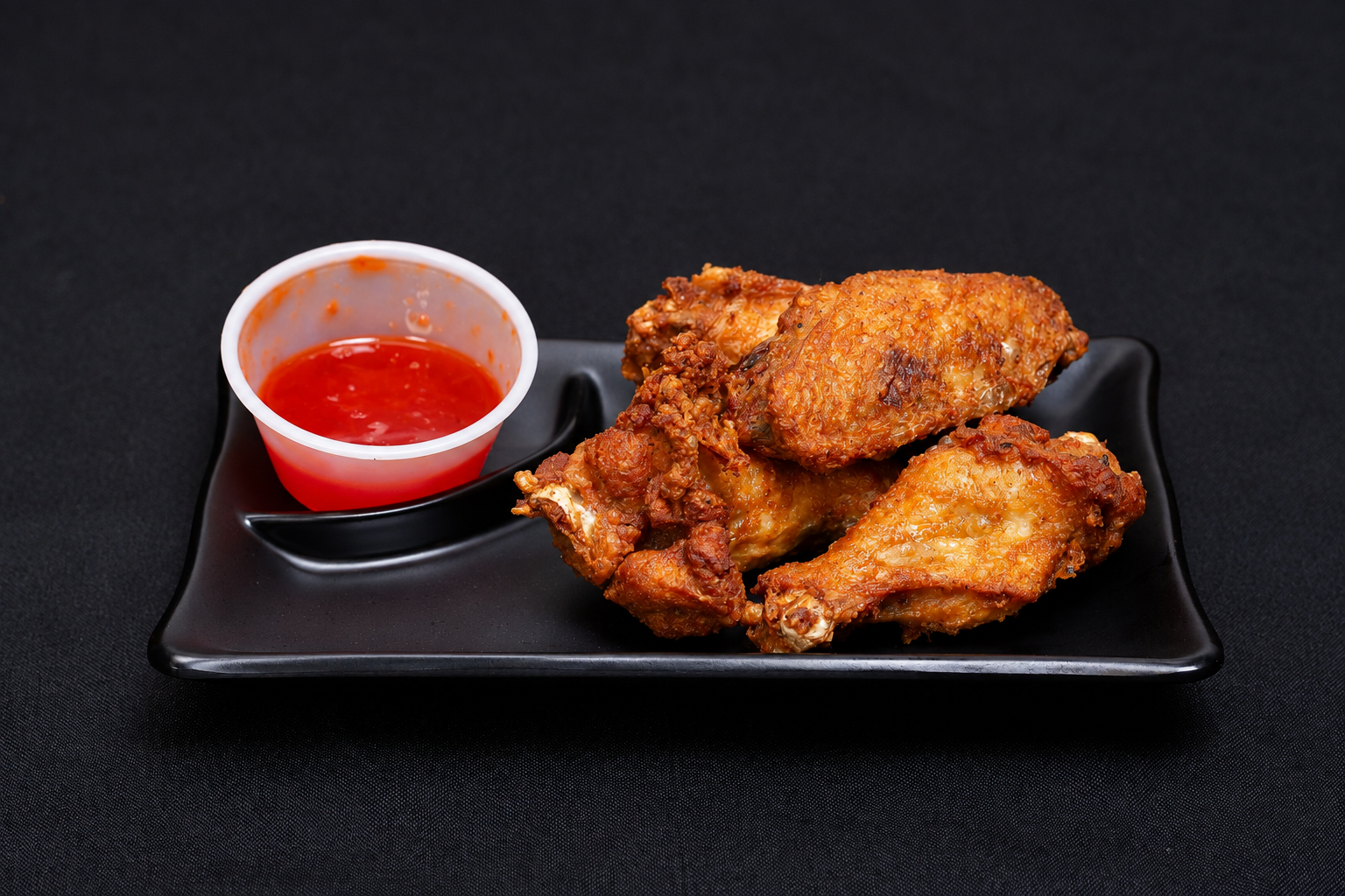 Fried chicken wings, photographed at Pho Dee Licious