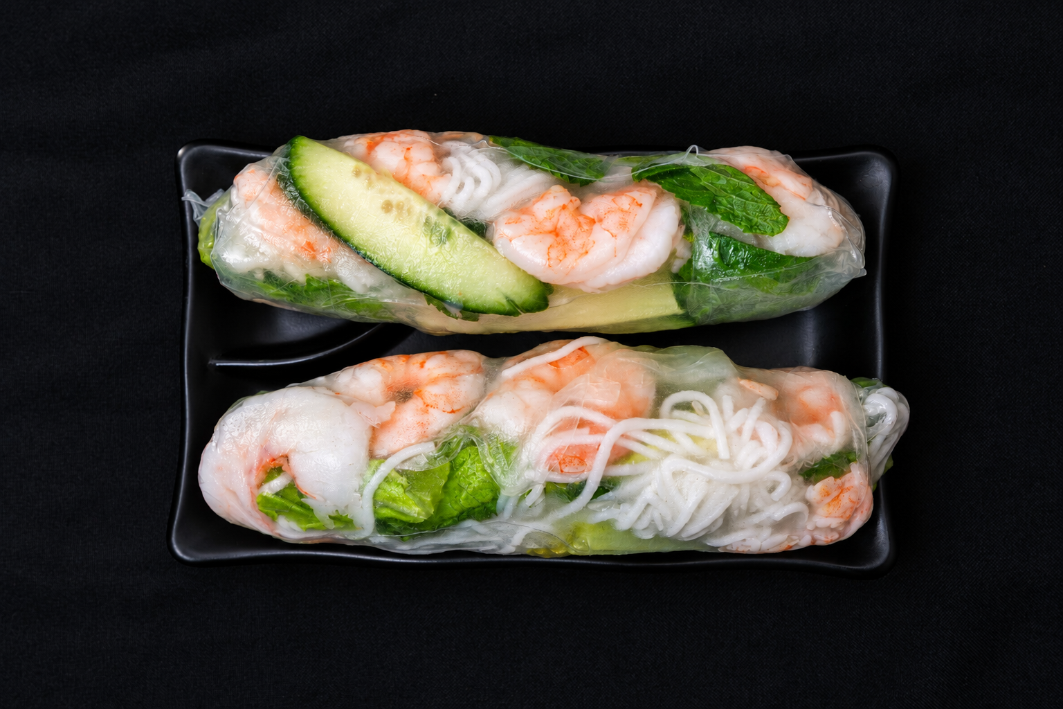 Shrimp spring rolls with rice noodles and greens